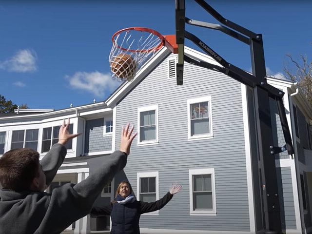 Latham Student and Staff play basketball.